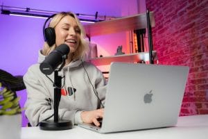 woman in studio podcasting